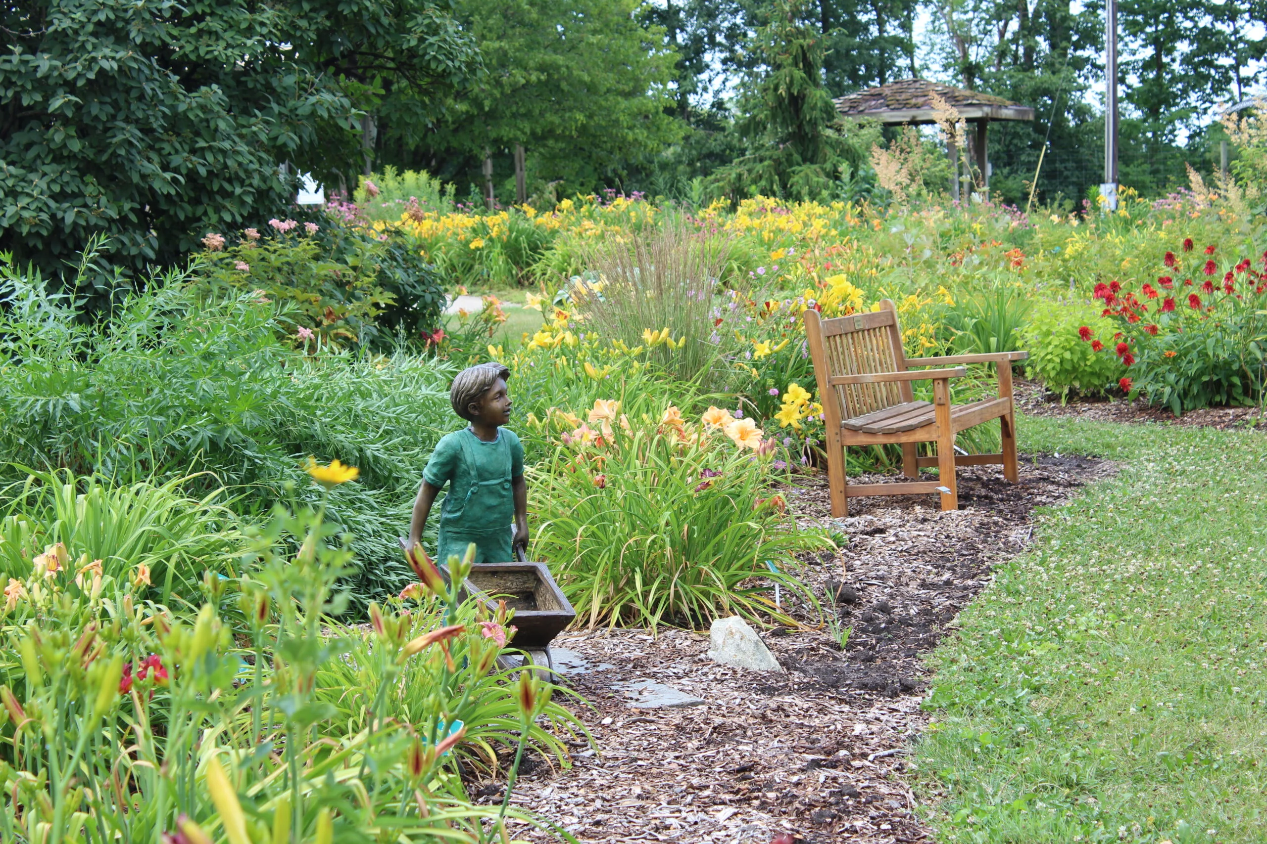 Boy statue in Perennial Gardens at Iowa Arboretum and Gardens